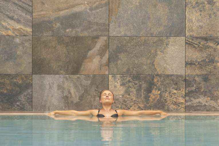 Saunton Sands Hotel Source Spa Guest Relaxing in Indoor Swimming Pool
