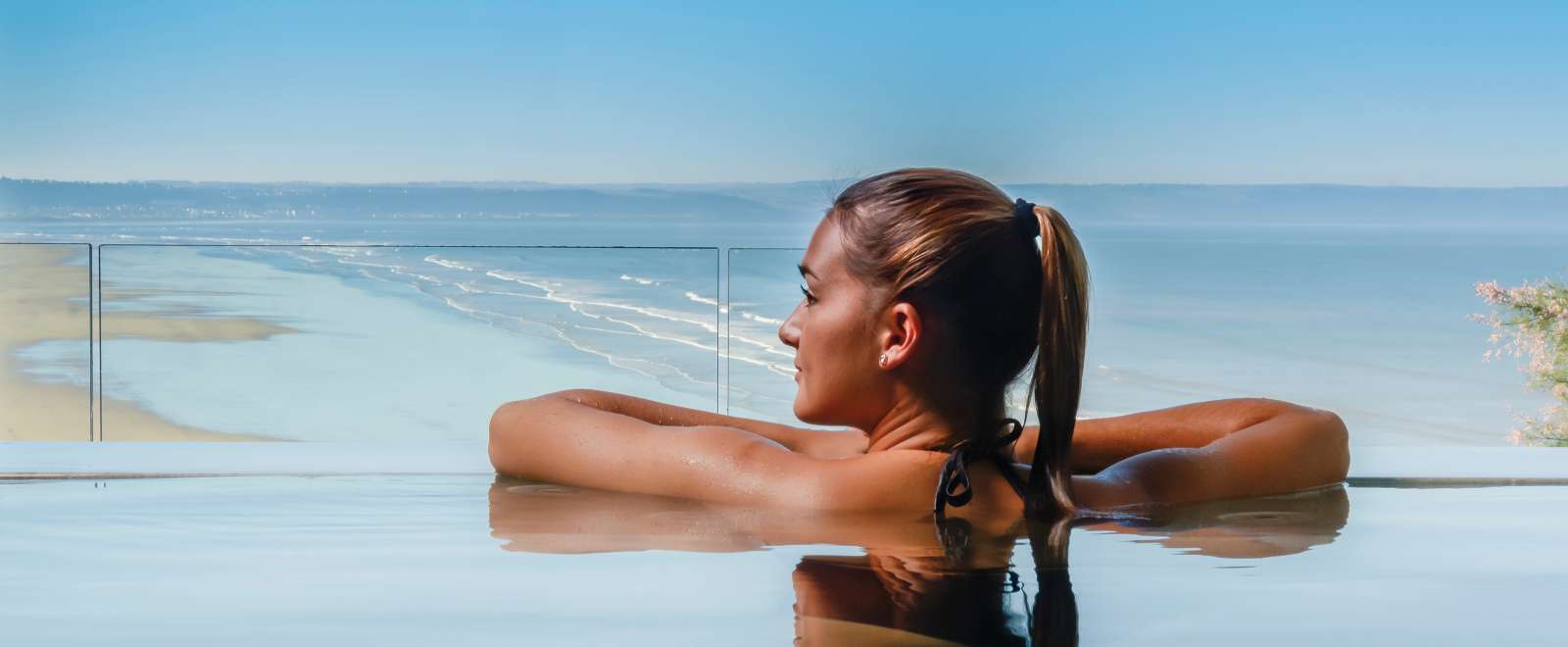 Saunton Sands Hotel Source Spa Guest in Vitality Pool Looking Out on Saunton Beach
