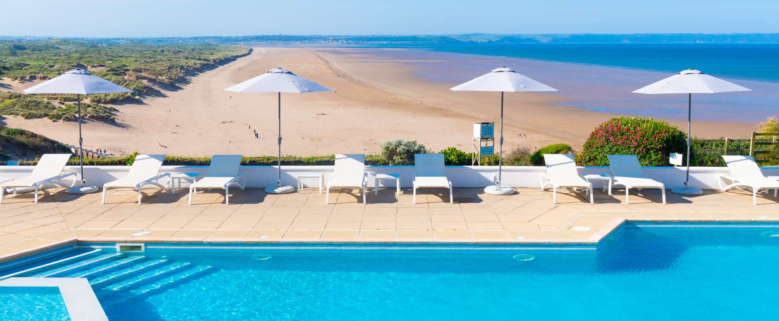 Outdoor swimming pool with brollies up