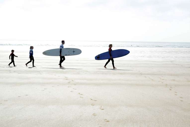 Saunton Sands Hotel Family Walking Across Saunton Beach with Surf Boards