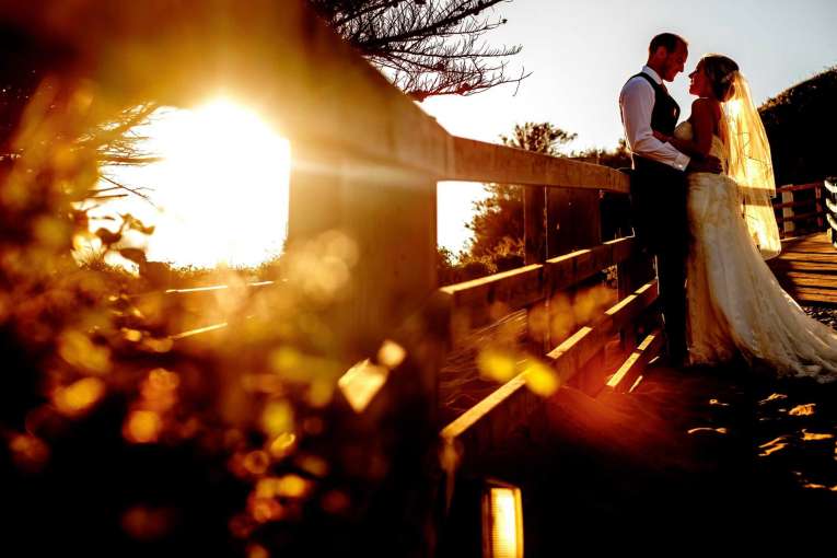 Bride and groom at Saunton in sunset