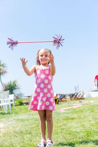 Young girl having fun outside at the circus workshop